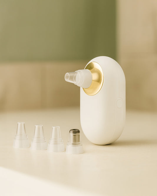 White and Gold Pocket Facial Deep Pore Cleaner with attachments sitting on cream bathroom counter top