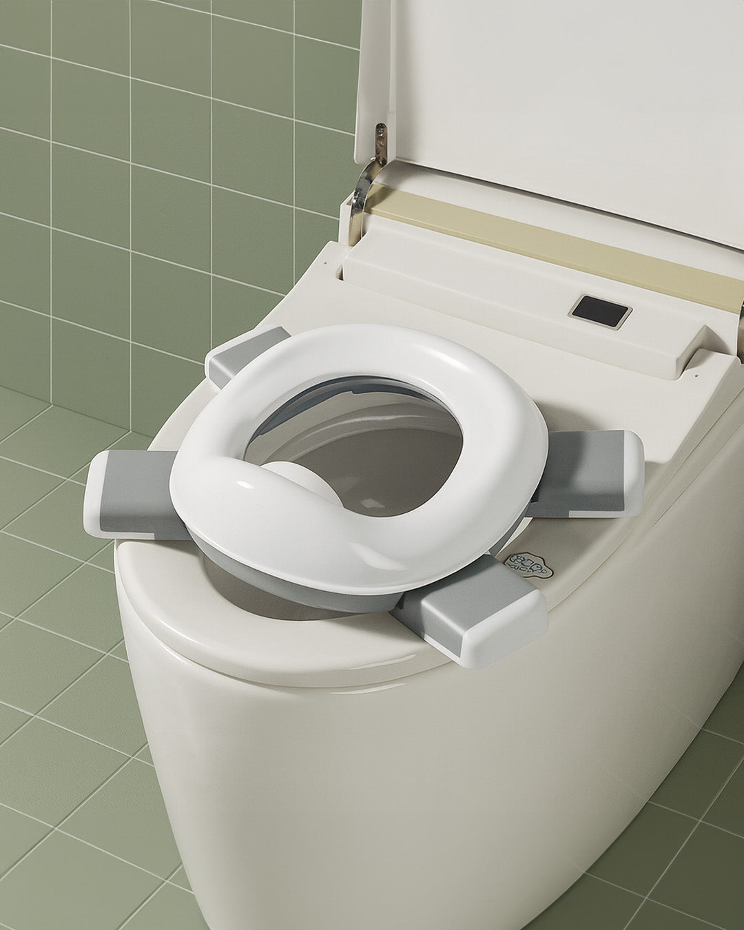 Toilet seat with a raised toilet seat cover on a tiled bathroom floor.