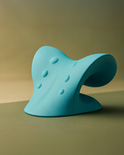 Blue massage pillow on a sage background