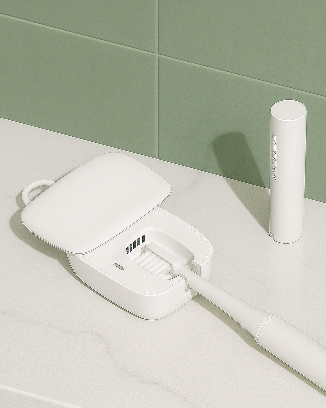 White toothbrush with UV sterilisier on a light surface against a green tiled wall.