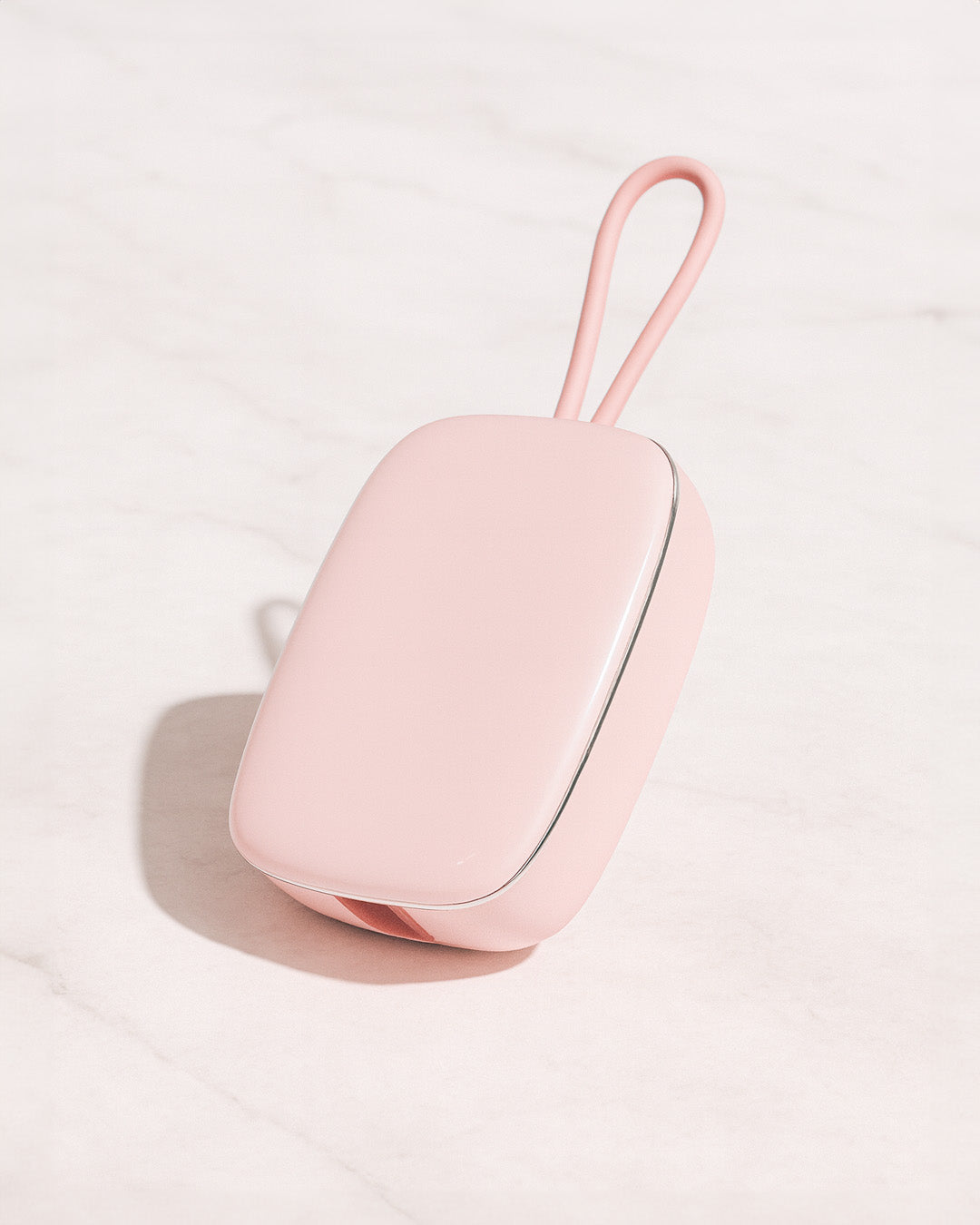 Pink Portable Toothbrush UV Steriliser with a handle on a light gray background