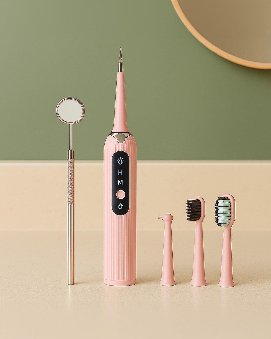 Pink dental tool set with multiple components on a beige surface against a green wall.