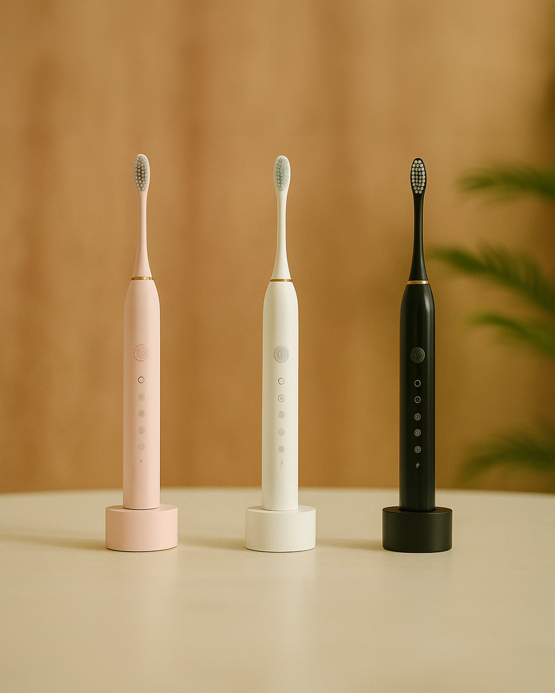 Three ultrasonic electric toothbrushes in pink, white, and black on a beige surface with a brown background.