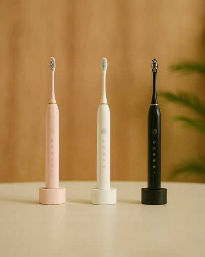 Three ultrasonic electric toothbrushes in pink, white, and black on a beige surface with a brown background.
