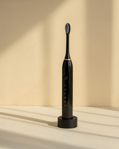 Black ultrasonic electric toothbrush on a beige background