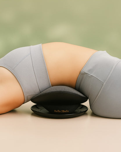 Person using a Bella Bello product on a beige surface with a green background